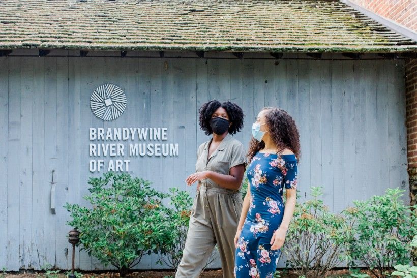 Two visitors walking up to the Brandywine River Museum of Art. Photo courtesy of VisitDelcoPA.com