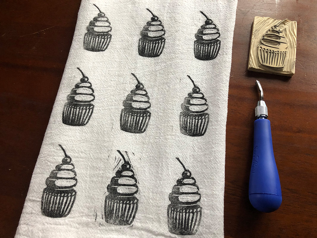 printed dishtowel with block print and tool