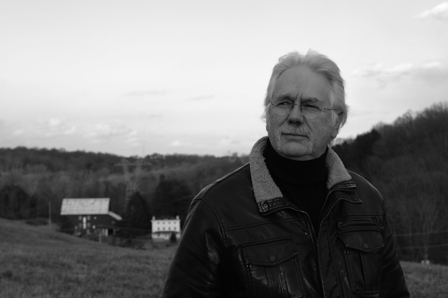 portrait of Karl Kuerner in a field