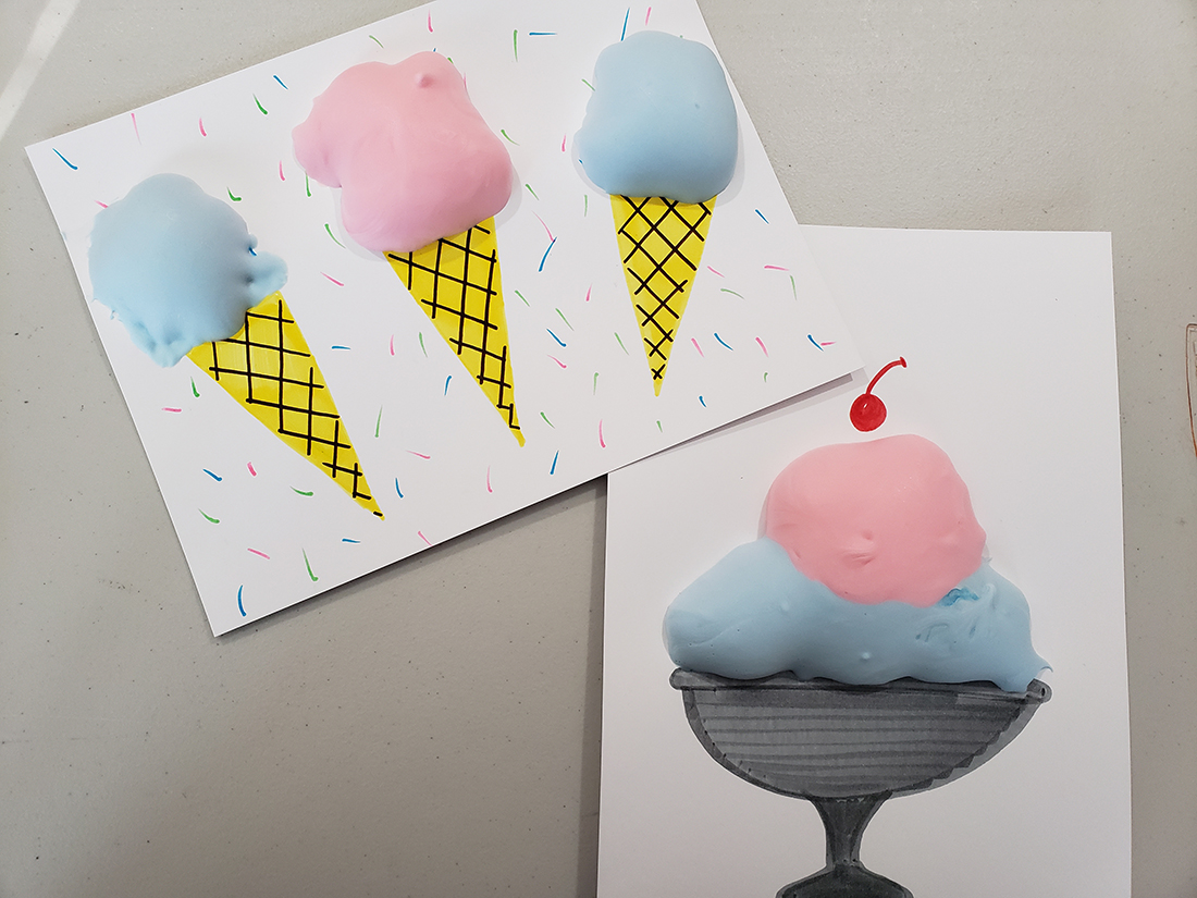Artwork projects displaying ice cream cones and an ice cream sundae created using pink and blue puff paint