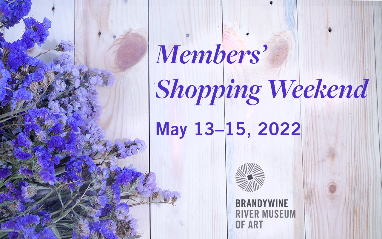 Purple flowers on a wood table with text that reads Members' Shopping Weekend, May 13-15, 2022. Brandywine River Museum of Art