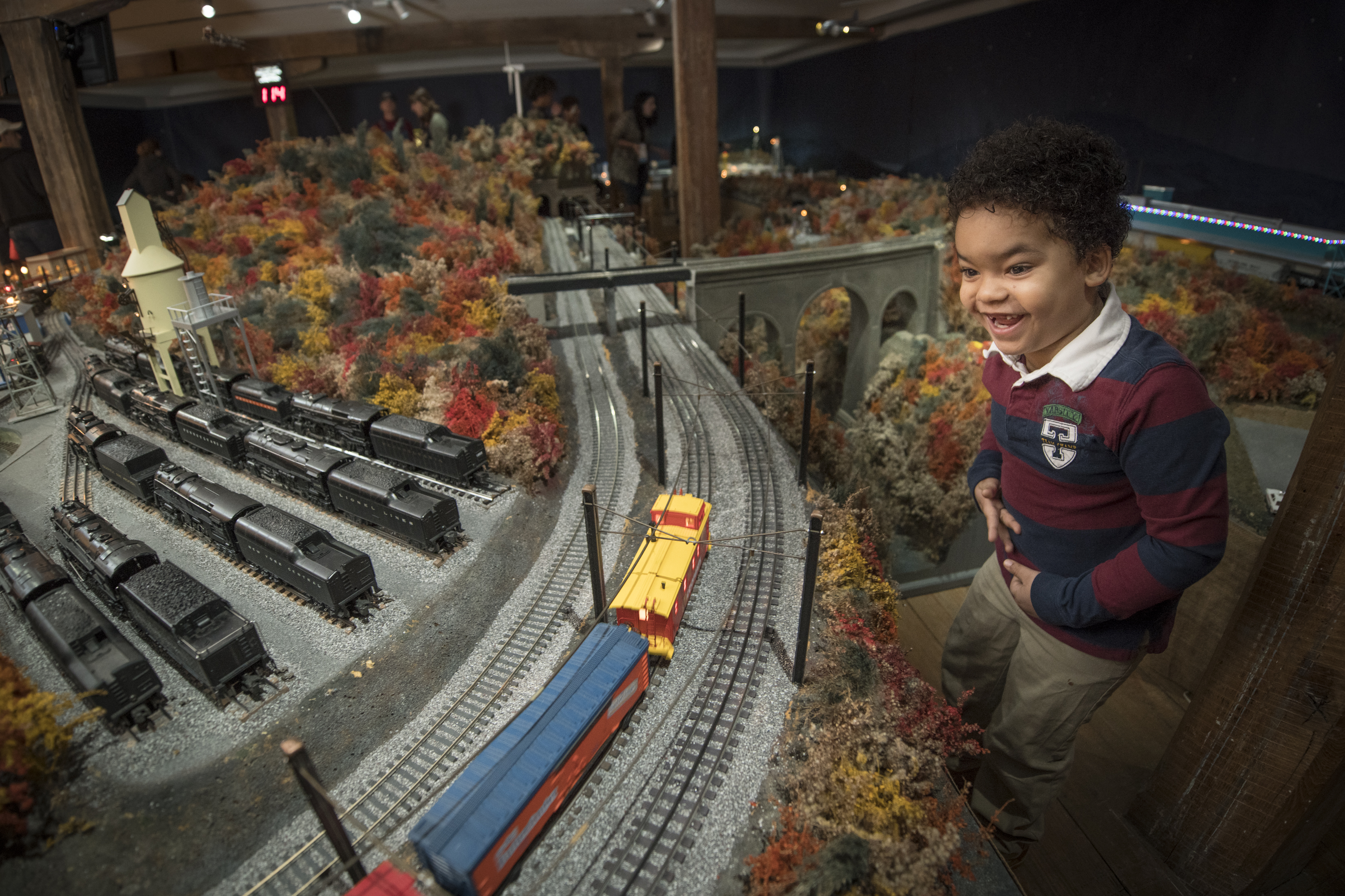 A young boy standing in front of the Brandywine Railroad model train display. Photo credit: Carlos Alejandro