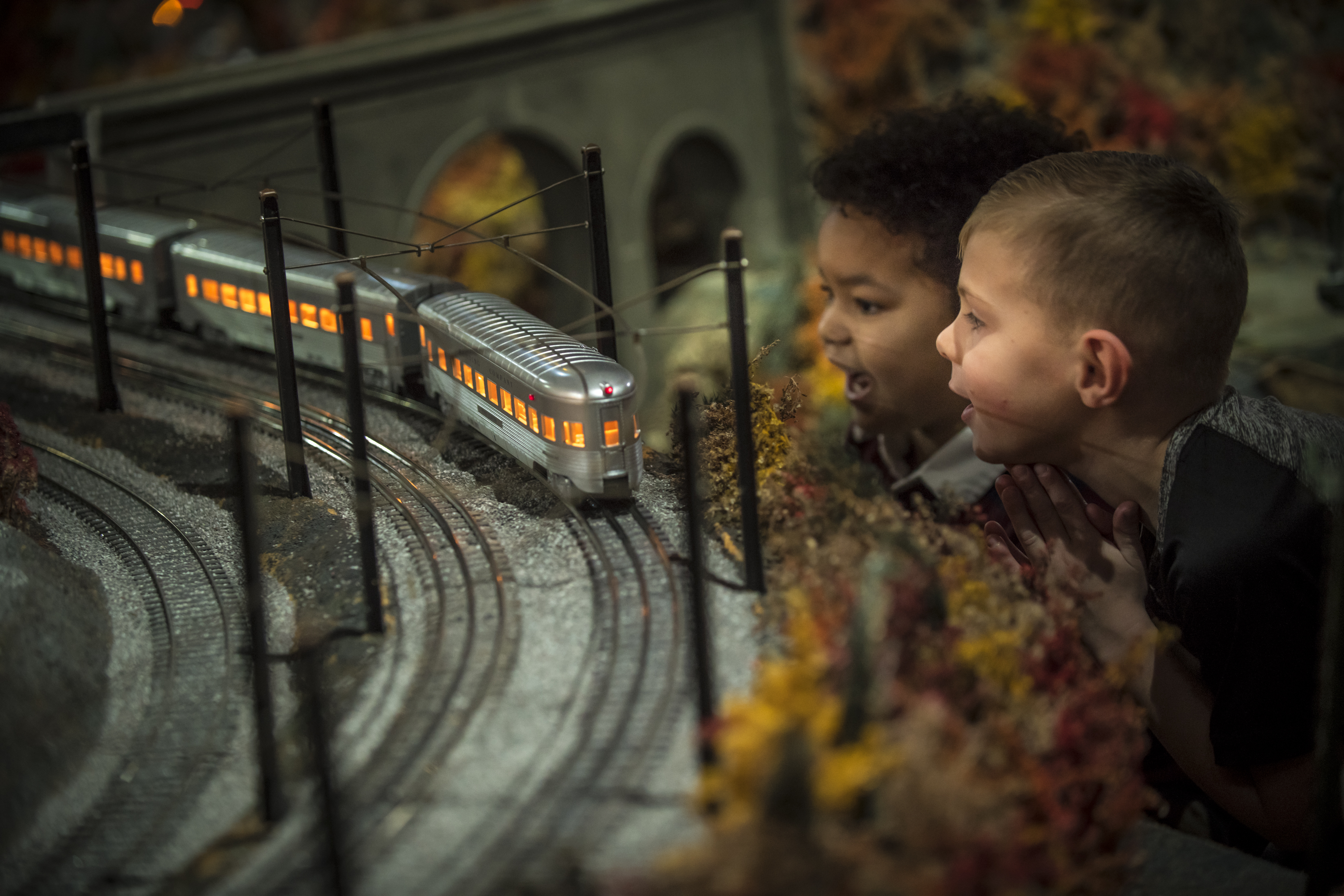Two young boys looking closely at the Brandywine Railroad model train display. Photo credit: Carlos Alejandro