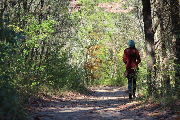 Woman walking in the woods