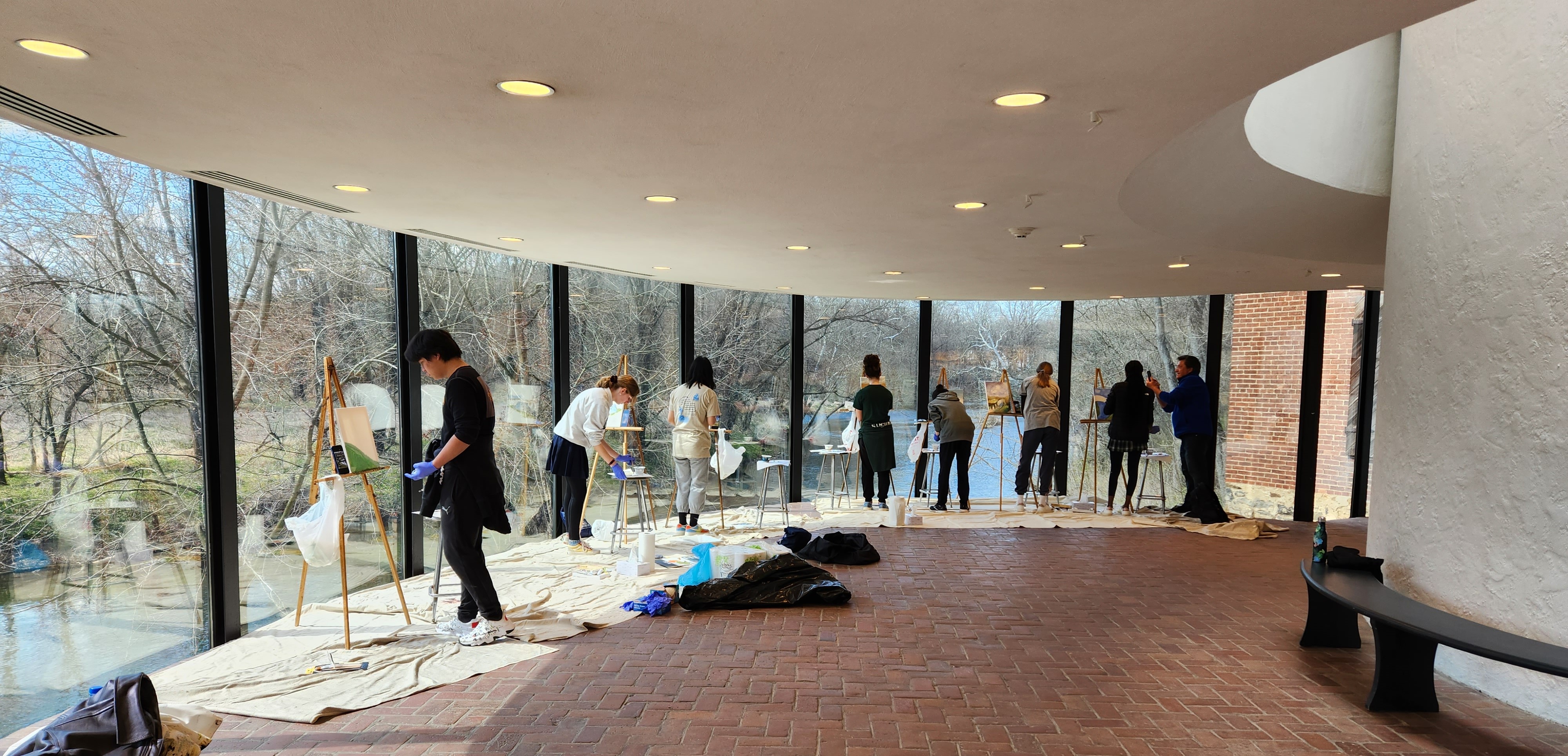 Individuals painting looking over the Brandywine Creek