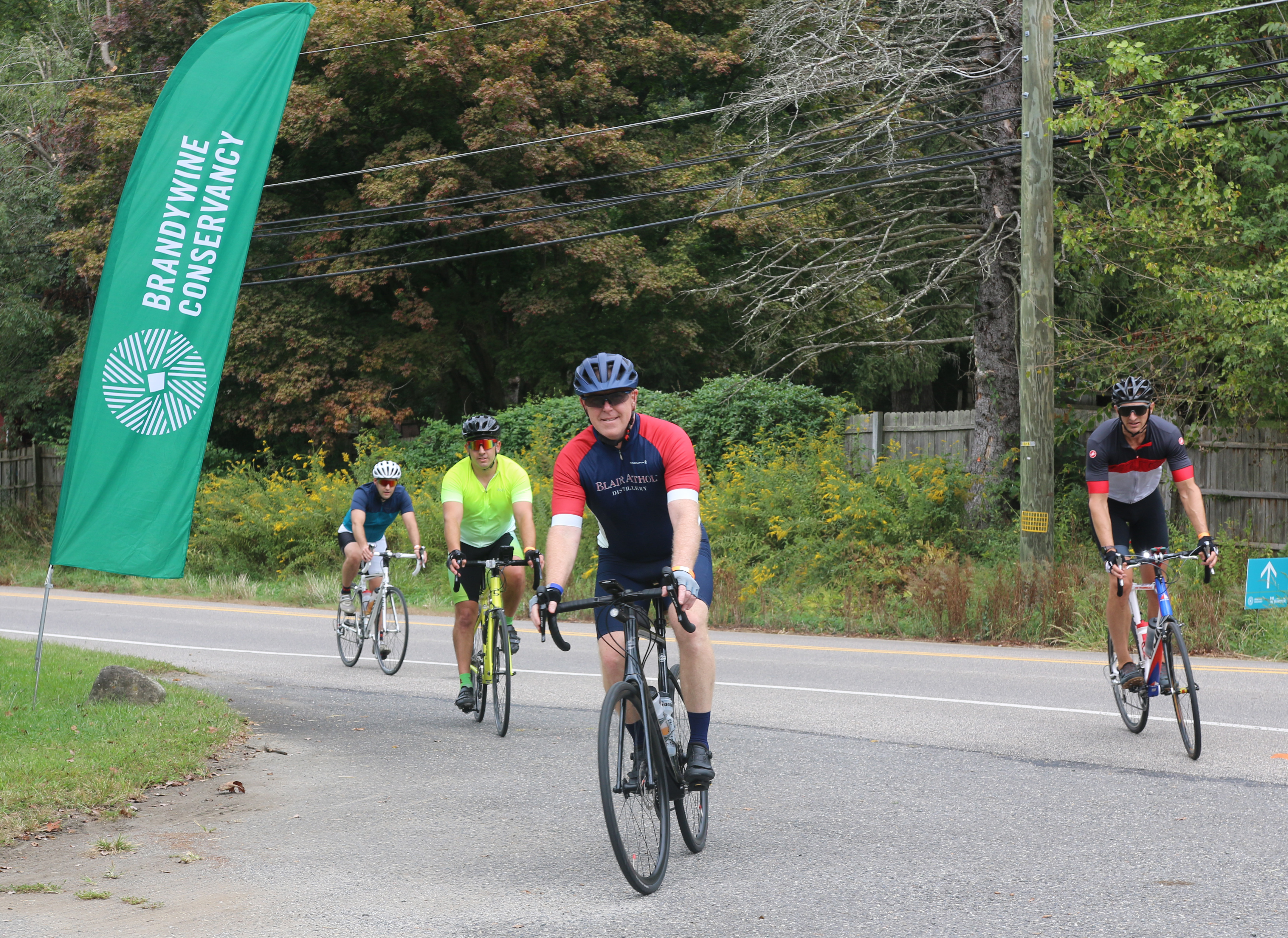 bicyclists ride to the finish at the 2024 Bike the Brandywine event