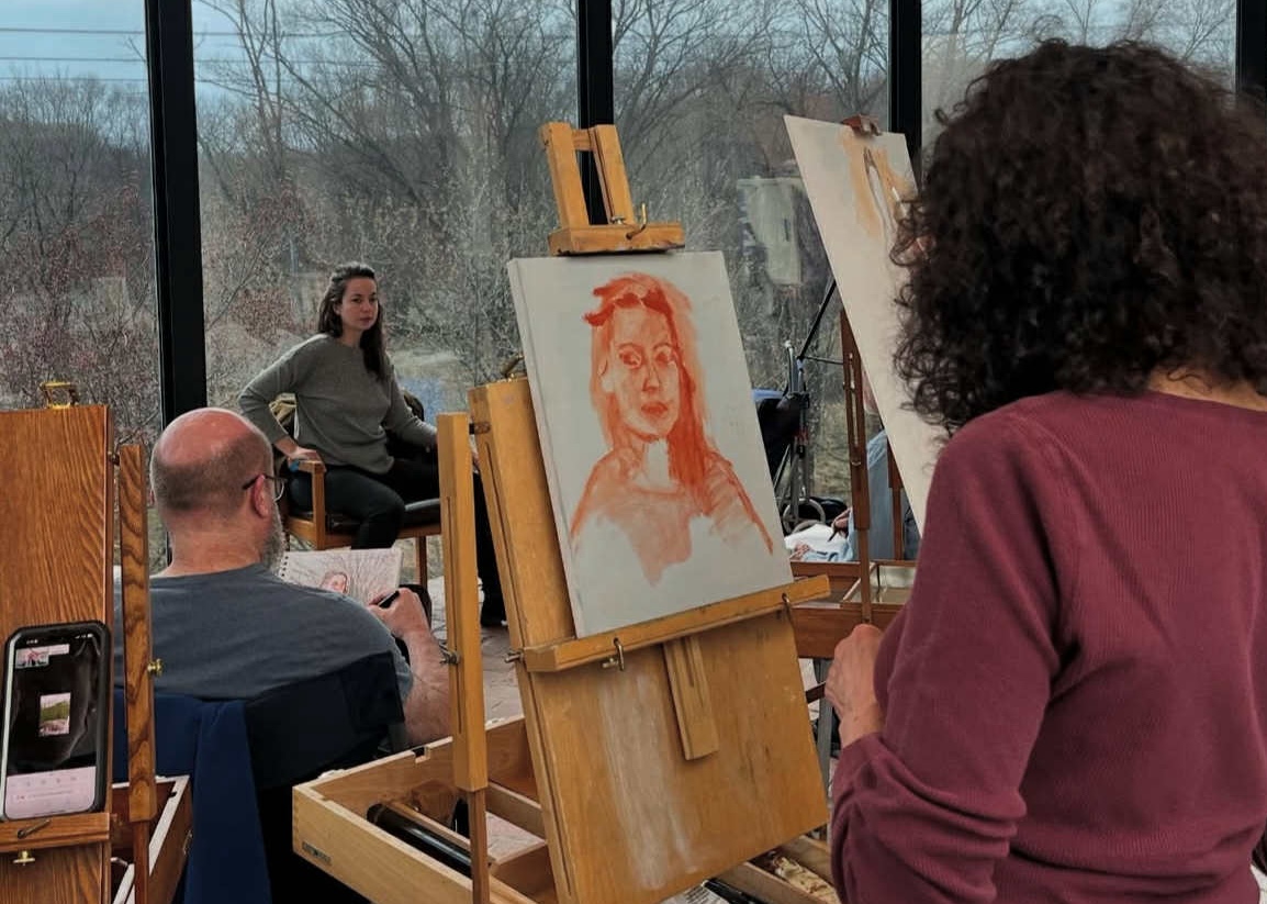 People drawing a live model