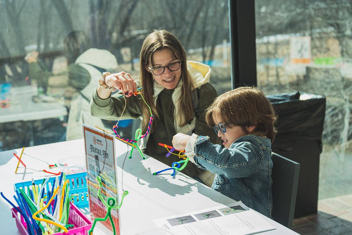 A child and parent making art together