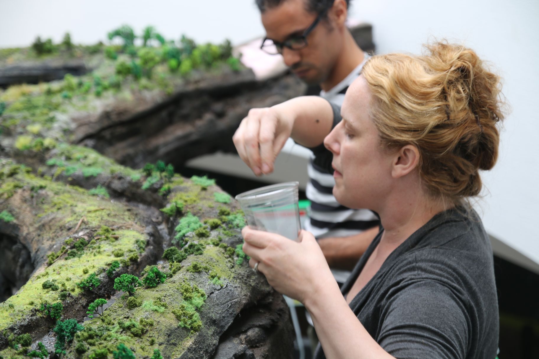 Kathleen Vance finishes a sculpture of the Brandywine River at the Brandywine River Museum of Art