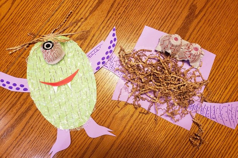 Monster creations made out of paper scraps and other packing materials