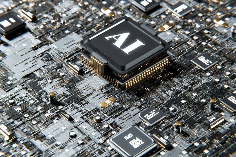 image of a computer board with a large black square with white lettering spelling AI