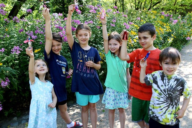 Children at Museum Explorers with their handmade clothespin characters