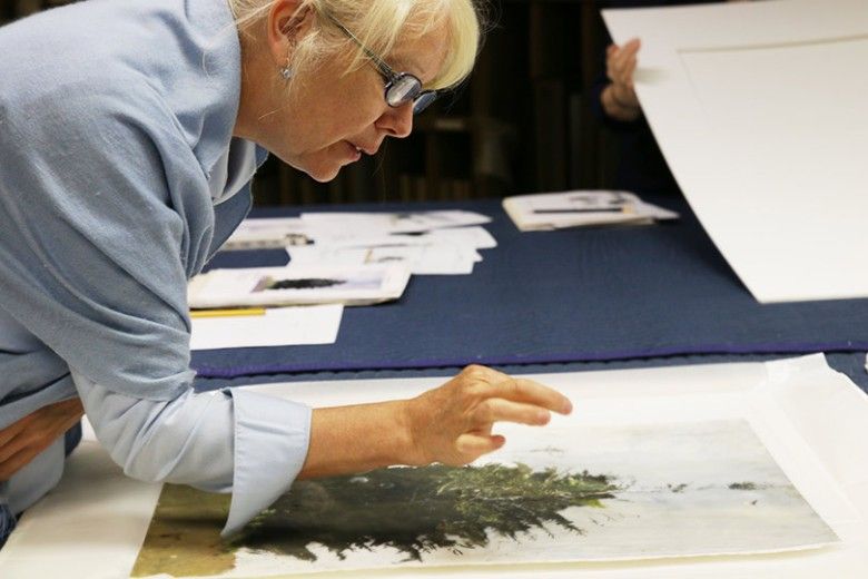 Examining an Andrew Wyeth watercolor