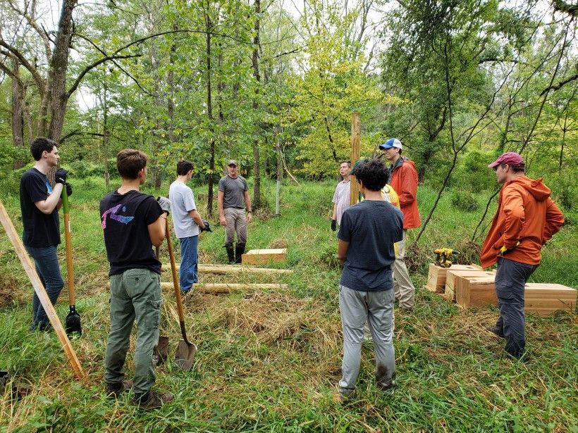 Eagle Scouts working at the Brandywine's Waterloo Mills Preserve