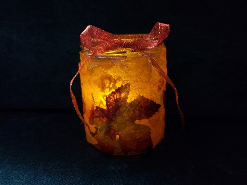 Illuminated fall leaf candle holder glowing in the dark