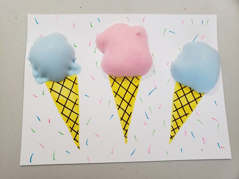 Photo of blue and pink puff paint ice cream cones, after they have finished drying.