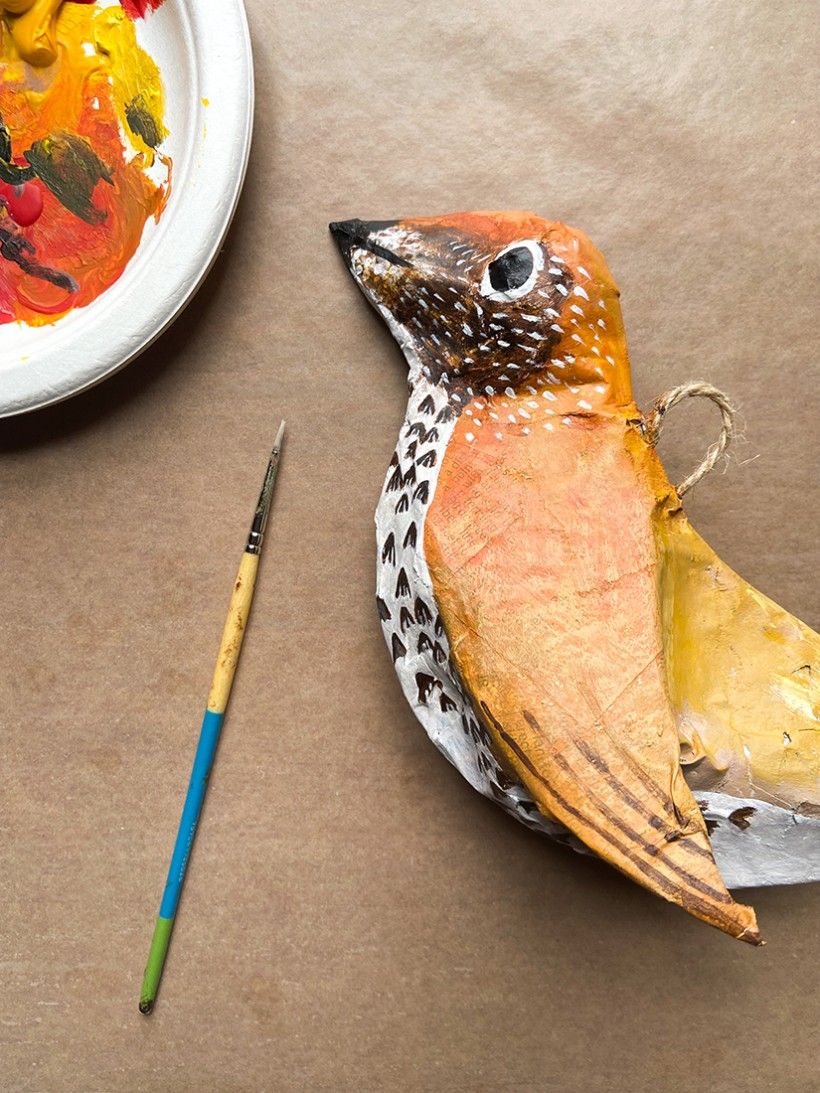 A detail of painted papier-mâché bird
