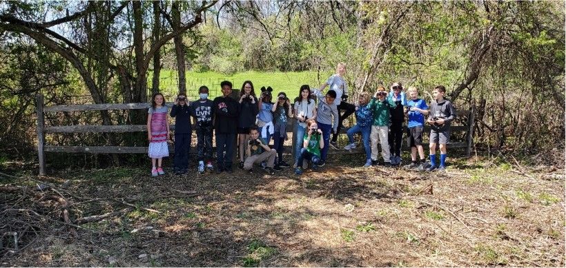 Photo of a Delaware County Christian School class in front of the new access gate at Waterloo Mills Preserve