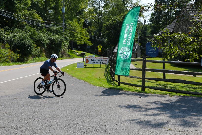 Cyclist riding into the Bike the Brandywine start/finish area