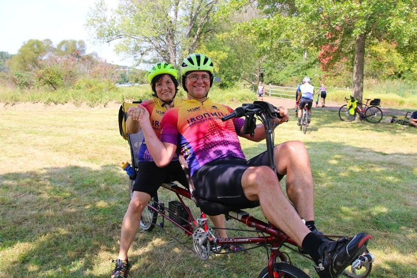 Two riders on a tandem bike