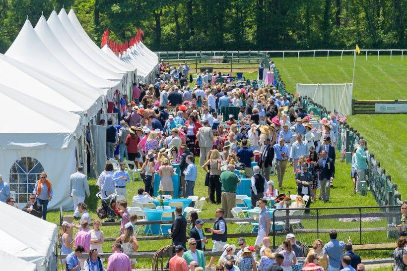 Tailgate crowd at the Radnor Hunt Races on a summer day in May.