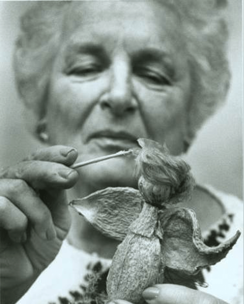 Woman hand painting a Christmas ornament
