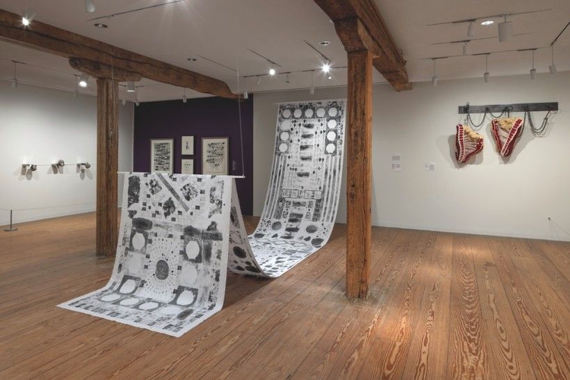 Image of an art gallery with large pieces of artwork installed