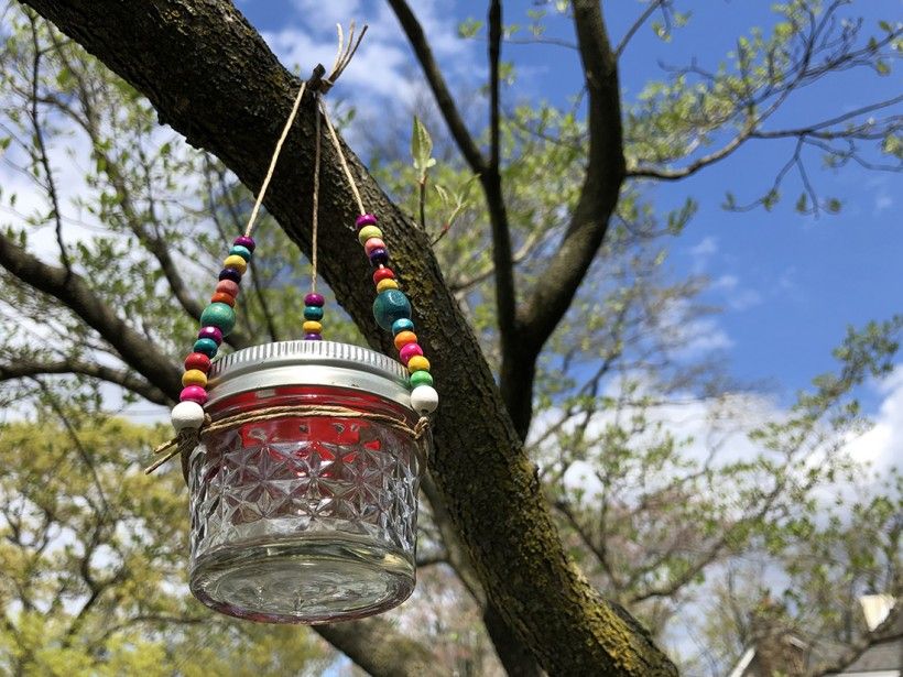 DIY Hummingbird Feeder hanging in a tree