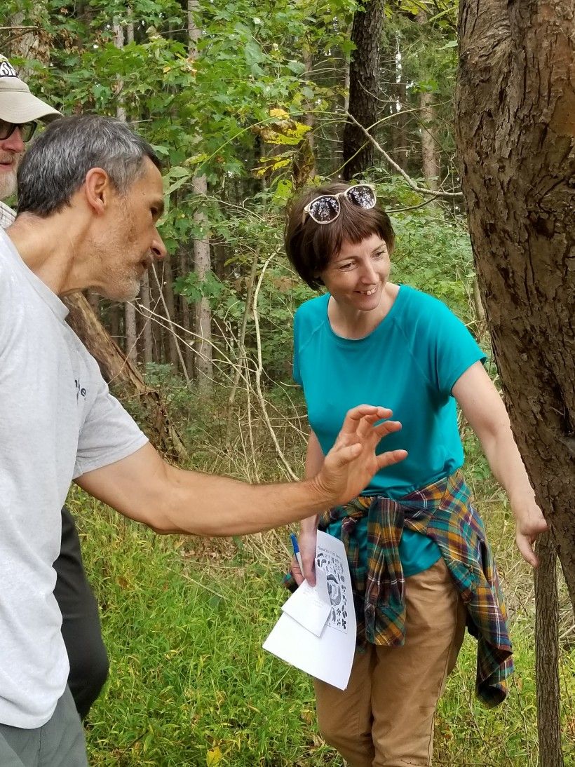 PMN participants Scott Jones and Tim Savisky and PMN Regional Coordinator, Maeve Rafferty, are in awe of the bear claw marks on an apple tree at Penguin Court.