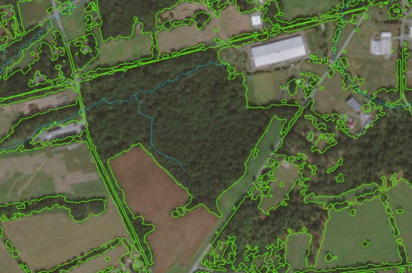 Recently acquired remote sensing data allows for accurate woodland delineation as shown by the green outline in this image.