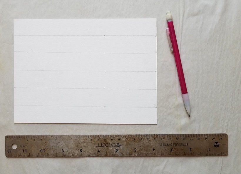 Photo of a white piece of paper with horizontal pencil lines, a pencil and a ruler