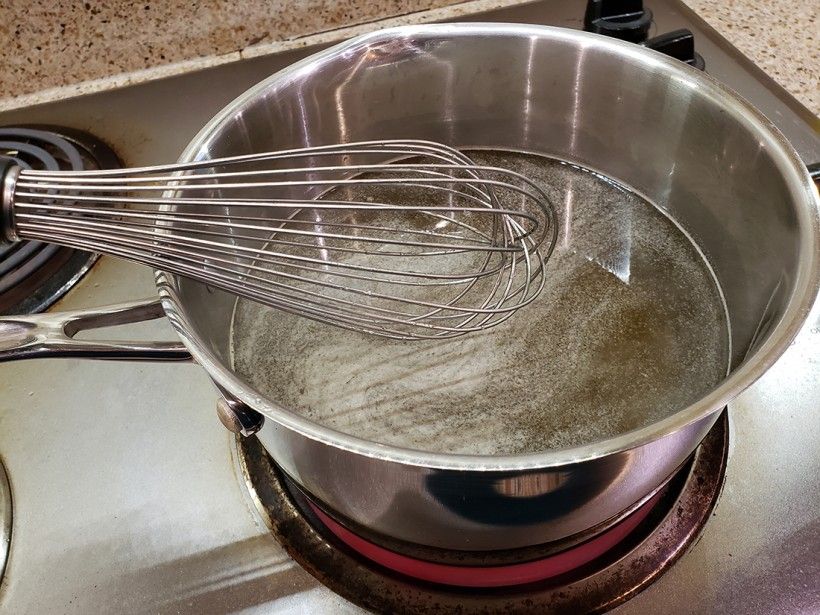 Cooking the dandelion simple syrup in a pot