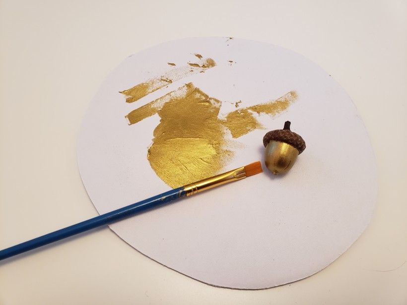 painting acorns with gold paint
