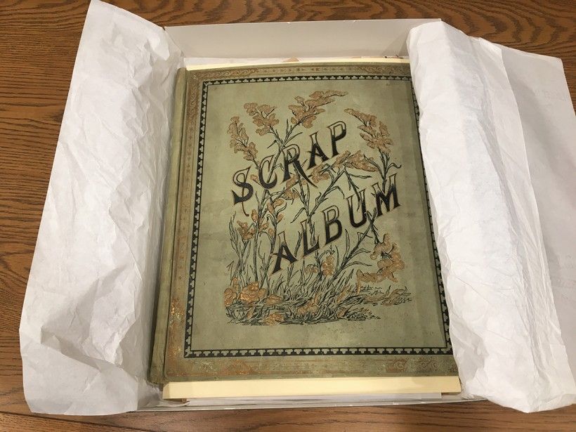 Emptied scrapbook wrapped in archival tissue. Emptied scrapbook wrapped in archival tissue.
