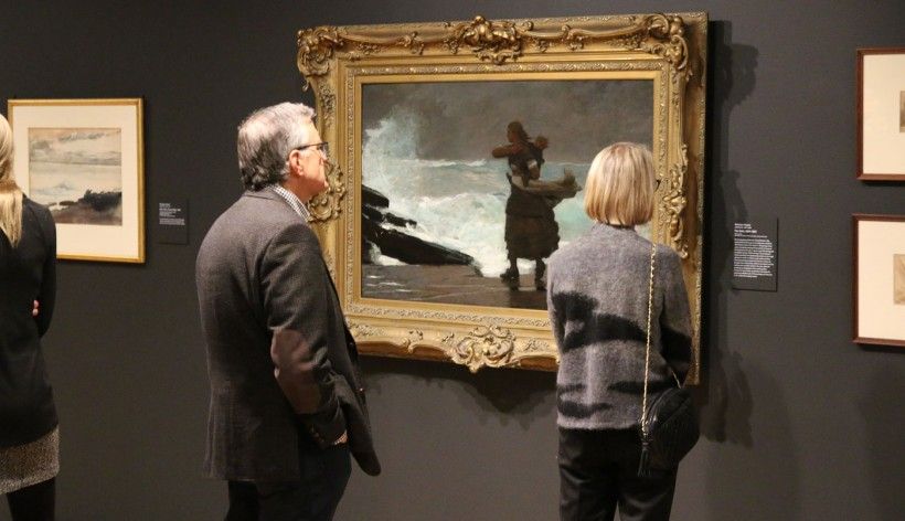 members looking at artwork