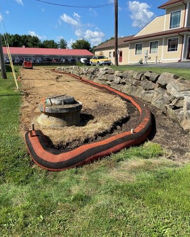 During Phase I photo of land being regraded during a stormwater runoff project