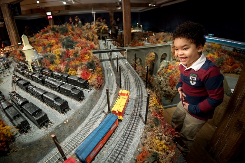 Boy with Brandywine Christmas train display 